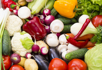 Background of fresh vegetables and greens closeup
