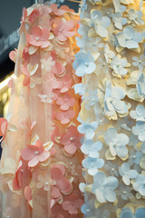 Transparent material for wedding dress with pink and blue flowers, vertical