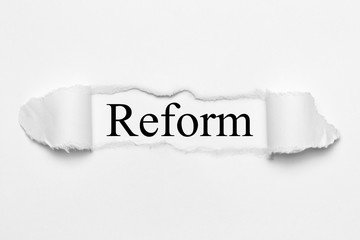Reform on white torn paper