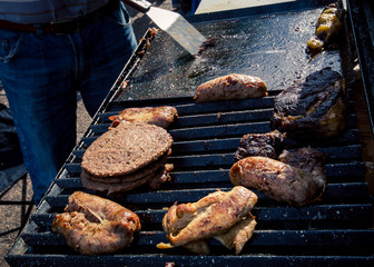 chicken and hamburger on grill 