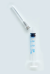 Disposable syringe isolated on white background.