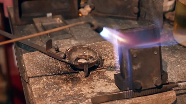 Goldsmith preparing tools for melting gold