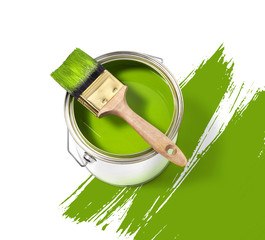 Green paint tin can with brush on top on a white background with