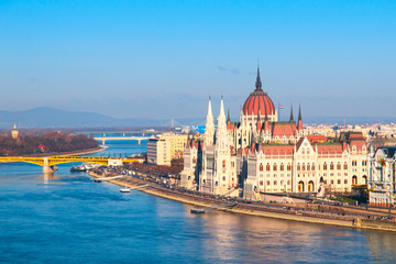 Fototapeta na wymiar Hungarian Parliament, aka Orszaghaz, historical building on Danube riverbank in the centre of Budapest, Hungary, Europe. UNESCO World Heritage Site. Aerial view from Buda Castle.