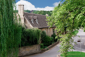 Fototapeta na wymiar Main road through charming Cotswold village of Lower Slaughter, England