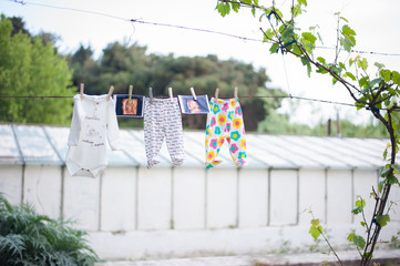 Baby clothes hanging on the clothesline, photos, creative