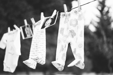 Baby clothes hanging on the clothesline, photos, creative