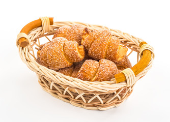 pile of fresh and delicious croissants on a white background