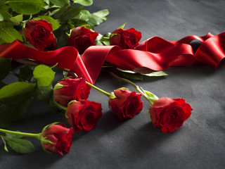 Ribbon with a bunch of red roses