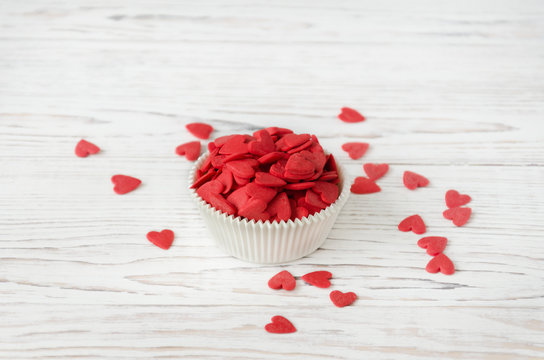 Red hearts are in the form for cupcakes