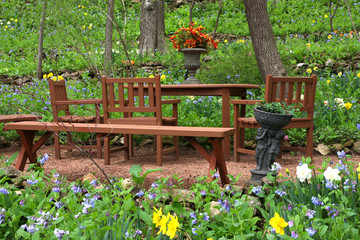 Natural landscaped back yard with outdoor furniture