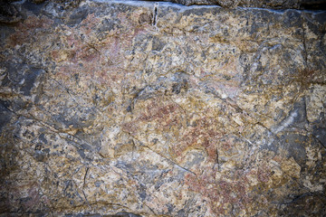 Dirty, scratched old stone wall