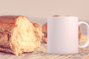 White blank coffee mug to add custom design/quote. Next to a loaf of bread.