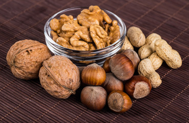 Nuts mix in a wooden plate