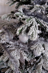 white christmas tree with silver decoration closeup studio shot