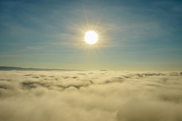 Fototapeta na wymiar Mist over mountain on during sunrise,sunlight effact