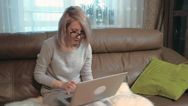Concentrated young businesswoman working on her laptop