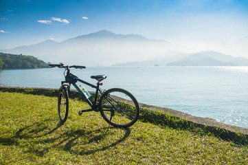 Bicycle in fron of the lake and mountain at Sun Moon Lake in Tai