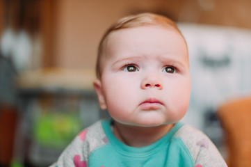 little cute baby toddler on carpet close up smiling adorable happy emotional playing at home