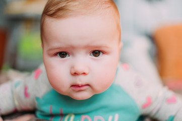 little cute baby toddler on carpet close up smiling adorable happy emotional playing at home