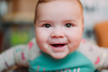 little cute baby toddler on carpet close up smiling adorable happy emotional playing at home