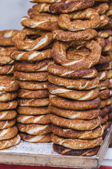 Turkish bagel simit close up. Fresh baked pastries for sale on t