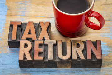 tax return word abstract in wood type