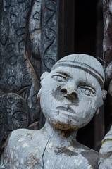 Detail of wood carving of male human at traditional Fon's palace in Bafut, Cameroon, Africa