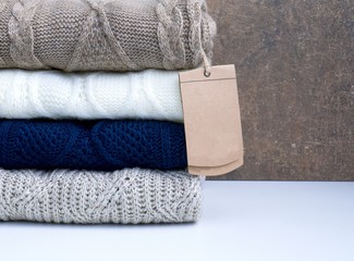 Stack of wool knitted warm sweater