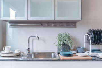 Fototapeta na wymiar modern kitchen room with sink on top granite counter
