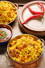 Chicken with basmati rice fried in stainless pan