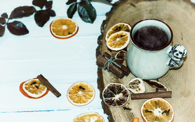cup of hot tea with steam on a wooden surface