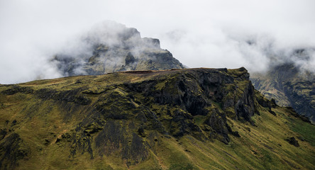 Volcanic rocks peeking out of the clouds on Eyjafjallajökull, Iceland