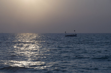 Fishing boat in the Indian ocean at sunset. GOA