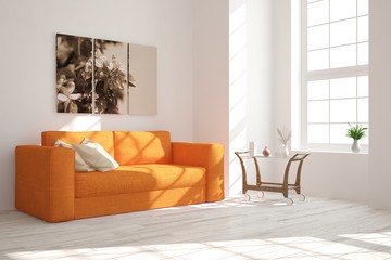Modern interior design with orange sofa