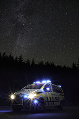 Police car and the milky way