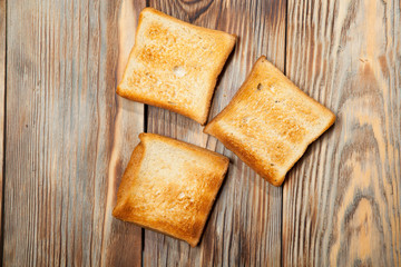 Toast on a rustic wooden background