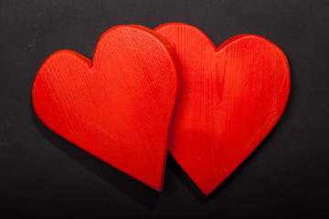 Holidays gift and heart on a black background. Valentines day