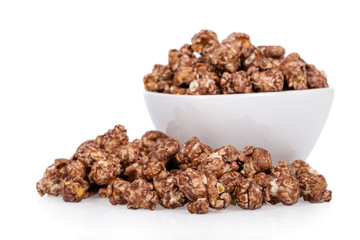 Popcorns flavored with sweet chocolate and mint in a bowl isolated on white background