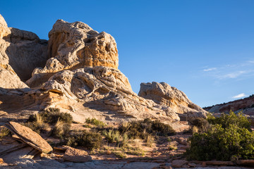 Fototapeta premium White and orange sandstone tower at sunrise