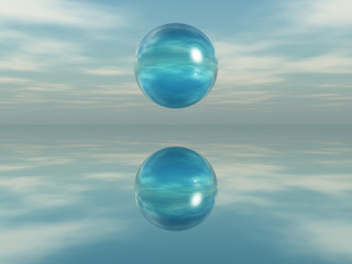 Fototapeta na wymiar Esfera de cristal flotando sobre una superficie espejada
