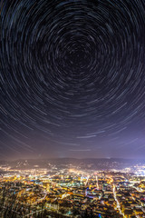 Star trails above city of Celje