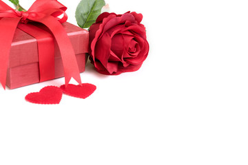 Red rose with present and two hearts