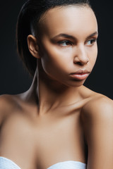 Beautiful young woman looking aside