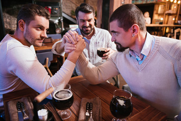 Handsome brutal men confronting each other