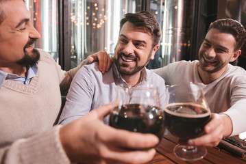 Positive male friends having fun