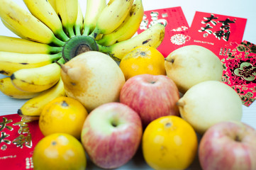Naklejka na ściany i meble various fruits in chinese new year, orange, watermelon, apples, pears and bananas