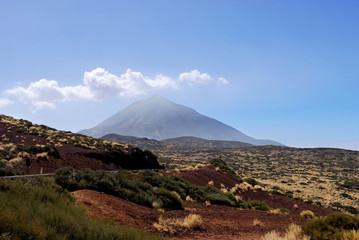 landscape with a volcano on a background of blue sky