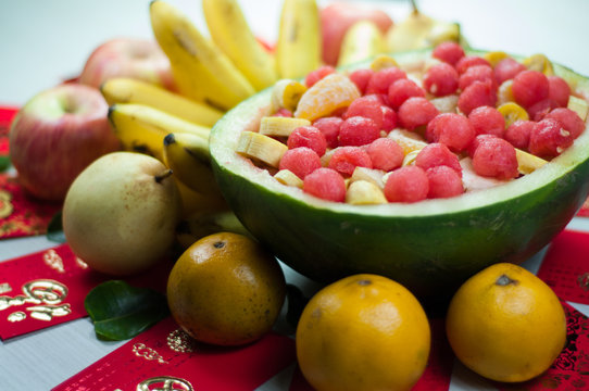 various fruits in chinese new year, orange, watermelon, apples, pears and bananas