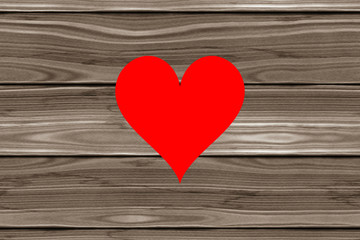Bright red heart symbol on wooden planks background